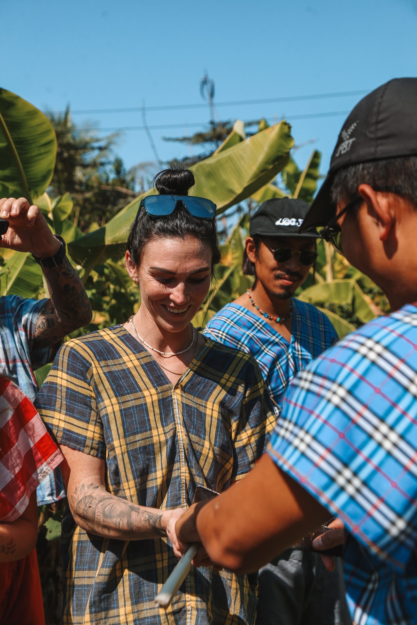 A diverse group of friends enjoying a sunny day outdoors in Chiang Mai, Thailand.